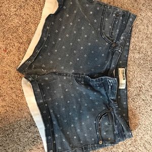 Cotton On jean shorts with white flowers. Size 10